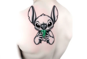 Stitch holding emerald birthstone for forearm tattoo idea