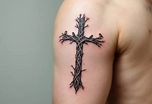 A forest-inspired Celtic cross made of intertwining tree branches, with small birds perched along its arms. tattoo idea