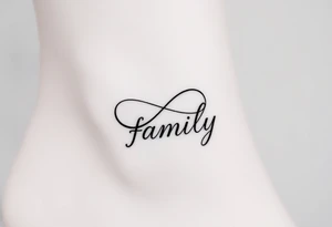 A flowing infinity symbol intertwined with the word "family" written in elegant cursive, symbolizing endless love and connection tattoo idea