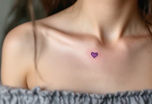 Matching tiny hearts shaded in lavender, placed delicately on each collarbone. tattoo idea