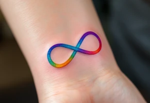A rainbow-colored infinity symbol reflects the limitless nature of freedom. tattoo idea