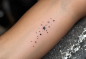 A subtle Sagittarius tattoo using only tiny white dots for stars, placed behind the ear. tattoo idea