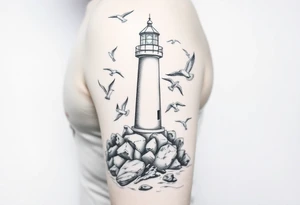 upper arm tattoo sea with lighthouse surrounded by seagulls tattoo idea