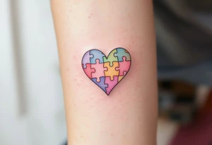 A heart made of puzzle pieces, each piece a different pastel, with Lenka in the center. tattoo idea