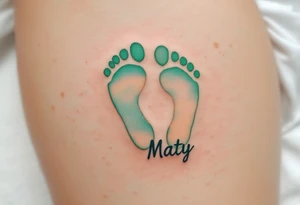 Warm, sandy beige and light green footprints of Maty name under it , with a heart-shaped outline to symbolize his love-filled steps in life. tattoo idea