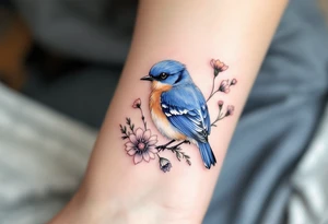 Puffy bluebird surrounded by wild flowers tattoo idea