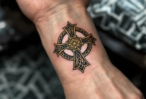 A black and gold Celtic cross, featuring intricate triquetra knots and a radiant golden halo around the center. tattoo idea