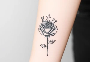 A rose with a large kings 
crown on-top of it tattoo idea