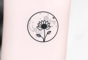 Small black and white tattoo full moon with small chrysanthemum and tiny scorpio gliph inside moon tattoo idea