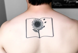 An open book with a sunflower and bees as one page tattoo idea