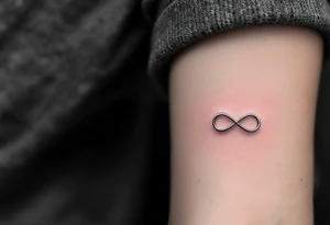 delicate silver infinity symbol, lightly shaded for a 3D metallic effect, symbolizing strength and eternity. tattoo idea
