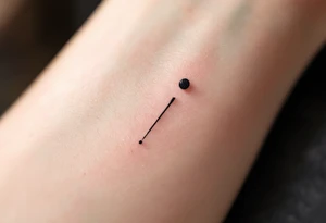 A single comma with a dot above it tattoo idea