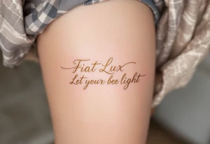 "Fiat Lux" (Let there be light), in cursive using light gold ink and pale gray shadows for contrast. tattoo idea