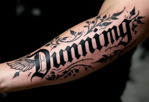 Dunning,on left arm details include angel wing, greek type of font,jungle leaves , tiger claw scratch tattoo idea