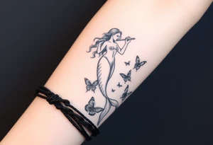 Aquarius goddess with mermaid tail Carrying  water bearer over her shoulder spilling water to the floor with a pisces fish in
Leading to butterflies tattoo idea