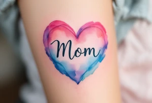 A watercolor heart in pink and blue with the word “Mom” scripted across it in elegant cursive. tattoo idea