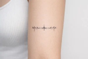 neckline tattoo along the collarbone tattoo idea