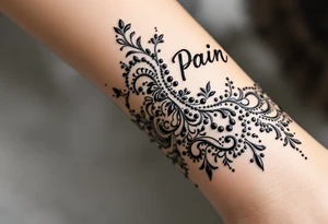 Indian style Henna tattoo for the inner wrist include the word pain in small font tattoo idea