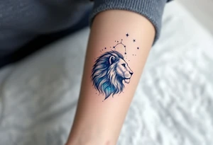A celestial lion formed from stardust and soft gray shading lies beneath the Leo star constellation, in a wash of indigo and teal. tattoo idea