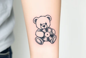 minimalist teddy bear holding a vinyl record tattoo idea
