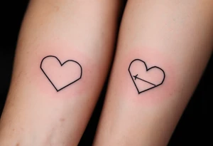 Matching minimalist black line heart tattoos symbolize the eternal bond between father and child. tattoo idea