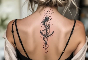 The Virgo maiden in black anchors a trail of pastel-colored stars that form the constellation on the upper spine. tattoo idea