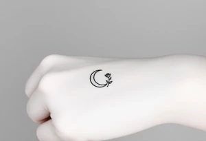 Small black and white tattoo waning crescent moon with small rose birth flower AND tiny Gemini gliph tattoo idea