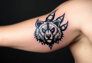 Bears paw with bear face in the middle tattoo idea