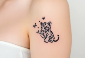 Tiger cub playing with butterflies tattoo idea