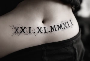 Elegant XXI.XI.MMXII in dark gray ink across the ribs, styled with subtle shadowing for a stone-carved effect. tattoo idea