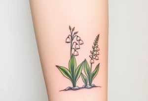Small White lily in the valley bells growing next to other different colored lilie plants planted 
Under a blooming hawthorn tree tattoo idea