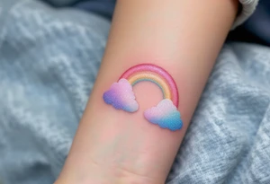 A pastel rainbow "S" with a glitter effect and soft cloud outlines. tattoo idea