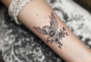 Solid bird with flowers tattoo idea