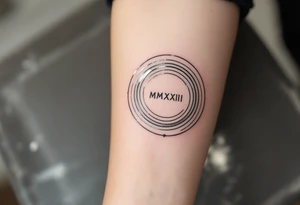 Modern IX.IX.MMXIII in black ink circling the forearm, with shadowed concentric rings in muted silver. tattoo idea