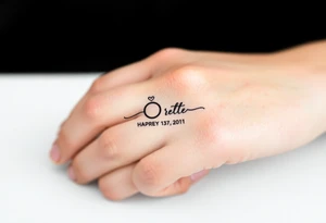 simple and elegant black wedding ring with the wedding date tattoo idea