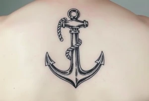 weathered anchor wrapped in nautical rope with sea waves tattoo idea