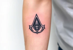 Assassins Creed emblem with Ezio hooded character tattoo idea