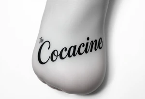 The word cocaine tattooed on foot tattoo idea