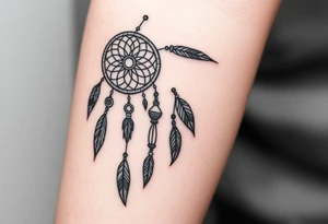 native dreamcatcher with flowing feathers and sacred beads tattoo idea