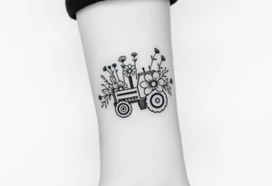 A bouquet of flowers with a tractor in it tattoo idea