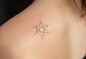 A gold eight-pointed star tattoo evokes celestial power and divine energy. tattoo idea