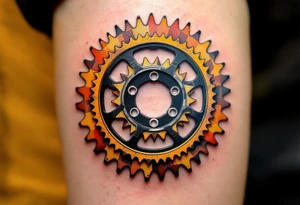 A cyclist’s chainring with the outer edges resembling a sunburst, using orange and yellow hues to create a radiant effect that captures the energy of a rider. tattoo idea