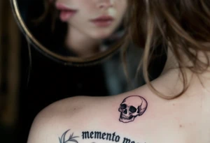 A Victorian-style framed mirror reflecting a skull in muted silver and black, with "memento mori" engraved along the edge. tattoo idea
