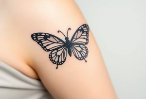 A black lace butterfly with intricately patterned wings, featuring subtle silver highlights tattoo idea