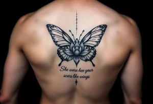Spine tattoo that has a butterfly with cracked wings and lotus flower with quote that says she wore her scars like wings tattoo idea