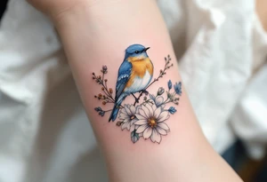 Puffy bluebird surrounded by wild flowers tattoo idea