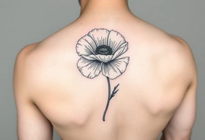 Poppy flower small fine line spine tattoo tattoo idea