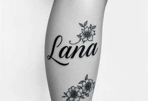 the name Lana going from my knee to my ankle the back of my leg with some flowers tattoo idea