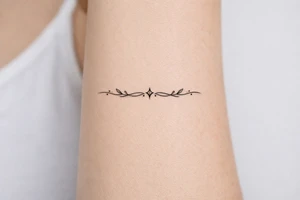 neckline tattoo along the collarbone tattoo idea