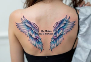 A pair of angel wings in light blue and lavender with “My Mother, She Is My Guide” between them. tattoo idea